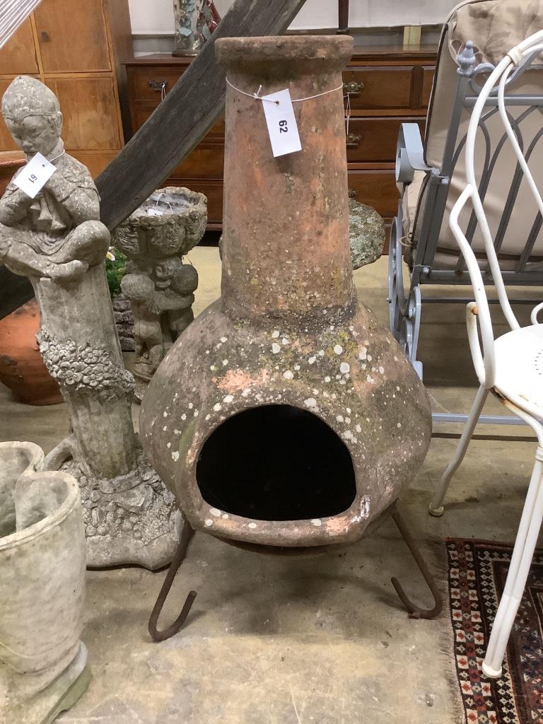 A terracotta garden chiminea, height 90cm